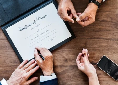 Family law attorney assisting a client with divorce legal documentation